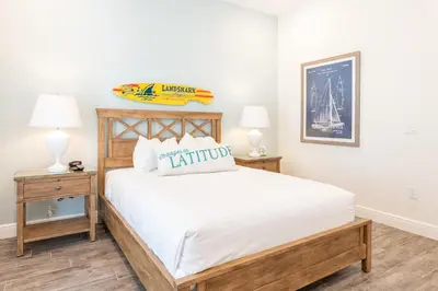 a bedroom with a large bed with two night stands at Sky Blue Cottage Near Disney With Margaritaville Resort & Island H2O Access - 8012Ff in Orlando