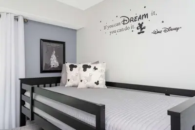 a bedroom with a black and white bed at Gorgeous 2 Bedroom Apartment Close to Disney 305 31911 in Kissimmee