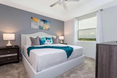 a bedroom with a white bed and a window at Gorgeous 2 Bedroom Apartment Close to Disney 305 31911 in Kissimmee