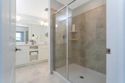a shower with a glass door in a bathroom at Gorgeous 2 Bedroom Apartment Close to Disney 305 31911 in Kissimmee