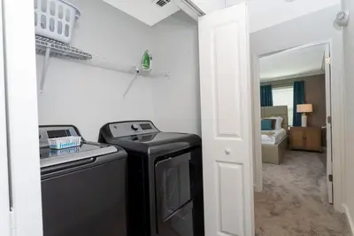 a kitchen with a stove and a sink in a room at Gorgeous 4 Bd w/ Pool Close to Disney @ Storey Lake 2963 in Kissimmee
