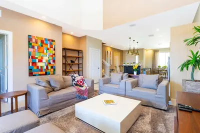 a living room with two couches and a coffee table at Stunning 4 Bd Close To Disney @ Magic Village 3247 in Orlando