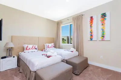 a bedroom with two beds and a window at Stunning 4 Bd Close To Disney @ Magic Village 3247 in Orlando