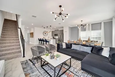 a living room with a couch and a table at 4200 Paragraph Drive in Kissimmee