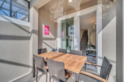 a dining room with a wooden table and chairs at 4200 Paragraph Drive in Kissimmee