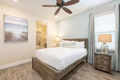 a bedroom with a bed and a ceiling fan at Cozy Cottage With Private Pool Near Disney With Margaritaville & Island H2O Access - 8036St in Orlando