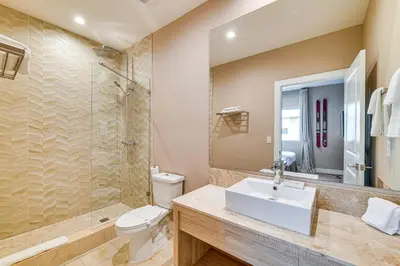 a bathroom with a toilet and a sink and a shower at Magic Villas Townhome about 5 Mi to Disney Parks! in Orlando