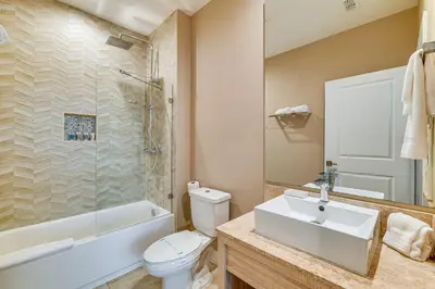 a bathroom with a sink and a toilet and a shower at Magic Villas Townhome about 5 Mi to Disney Parks! in Orlando