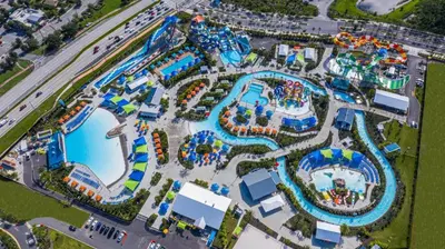 an overhead view of a water park with an amusement park at Sunburnt Cottage With Hot Tub Near Disney With Margaritaville Resort & Island H2O Access - 8041Sh in Orlando