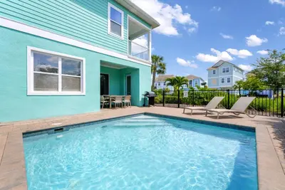 a swimming pool in front of a house at Dreamy Cottage With Private Pool Near Disney With Margaritaville Resort & Island H2O Access - 8082Kd in Orlando