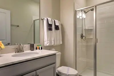 a bathroom with a sink and a shower and a toilet at 5 Mi to Disney Chic Townhome with Community Perks! in Kissimmee