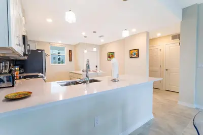 a kitchen with a sink and a counter top at Stunning 2Bd Apto Close to Disney @ Storey Lake 105P 3171 in Kissimmee