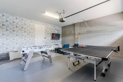 a ping pong room with a ping pong table at Encore Resort 6 Bedroom Home with Pool 2300 in Orlando