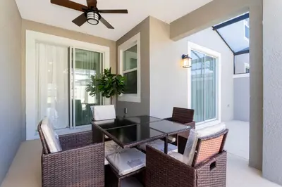 a dining room with a table and chairs and a ceiling fan at Gorgeous 4 Bd Close to Disney w/ Pool @ Storey Lake Resort 4245 in Kissimmee