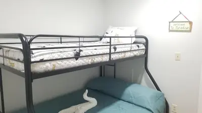 a bunk bed with a white snake on the bottom bunk at 3697 Orlando Vacational Apartment in Orlando