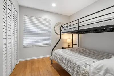 a bedroom with a bunk bed and a window at 3697 Orlando Vacational Apartment in Orlando