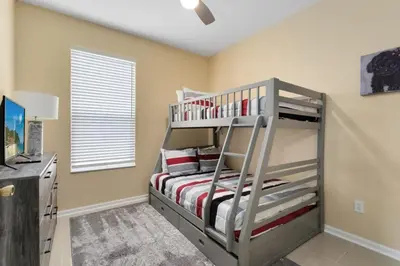 a bedroom with a bunk bed in a room at Amazing Disney Dream Getaway in Windsor Palms! villa in Kissimmee