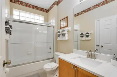 a bathroom with a shower and a toilet and a sink at Amazing Disney Dream Getaway in Windsor Palms! villa in Kissimmee