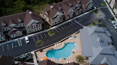 an aerial view of a house with a swimming pool at Stylish Family Villa 5min Disney BBQ 1804ft in Orlando