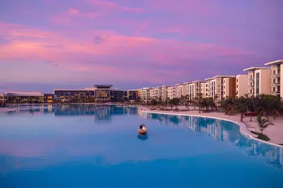 a person swimming in a large pool in a resort at Evermore Orlando Resort in Orlando
