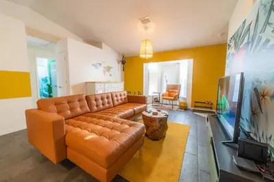 a living room with a couch and a television at Newly Updated 3 Bedroom Home in Kissimmee