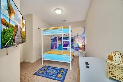 a bedroom with a bunk bed in a room at Bright 3BR Condo With Pool, Close to Disney! in Orlando