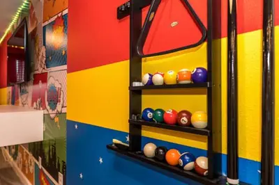 a shelf with balls on the side of a bus at Disney Decorated Home 8min Disneyworld Pool/Spa Sleeps 22 in Kissimmee