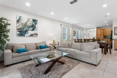 a living room with a couch and a table at 7500 Marker av in Orlando