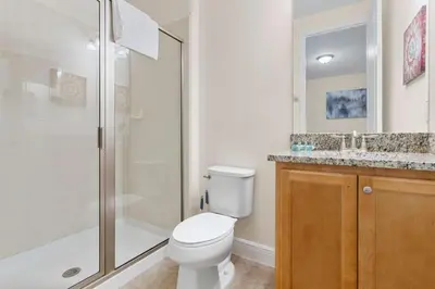 a bathroom with a toilet and a shower and a sink at 7500 Marker av in Orlando