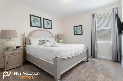 a bedroom with a white bed and a window at 361 Pendant ct in Orlando