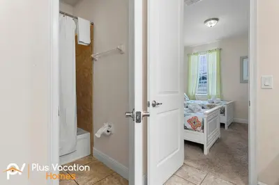 a bathroom with a door leading to a bedroom at 361 Pendant ct in Orlando