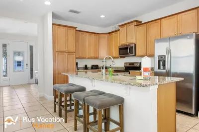 a kitchen with wooden cabinets and stainless steel appliances at 361 Pendant ct in Orlando