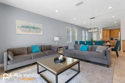 a living room with two couches and a table at 361 Pendant ct in Orlando