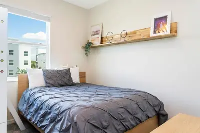 a bedroom with a bed and a window at Gorgeous 3Bd 2Ba Apt Close to Disney @ Storey Lake Orlando 208 3180 in Kissimmee