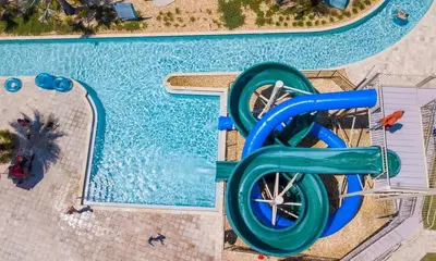 an overhead view of a pool with a water slide at Gorgeous 3Bd 2Ba Apt Close to Disney @ Storey Lake Orlando 208 3180 in Kissimmee
