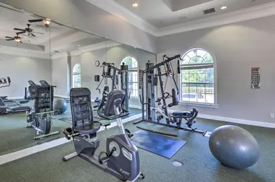 a gym with treadmills and exercise equipment in a house at Sun-Soaked Kissimmee Gem with Resort Amenities! in Kissimmee