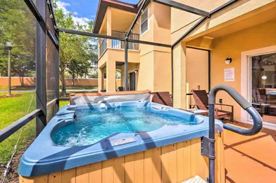 a hot tub on the side of a house at Disney-Inspired Townhome with Private Hot Tub! in Orlando
