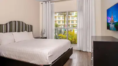 a bedroom with a bed and a large window at Hotel Apt at Celebration 10 min from Disney MH225 in Orlando