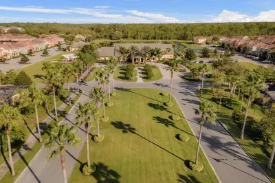 an aerial view of a park with palm trees at Fun Family Villa Pool BBQ Near Disney World 5BR in Kissimmee