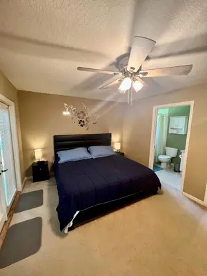 a bedroom with a bed and a ceiling fan at Grand Villas of Island 3BR Condo near Disney Parks and Universal in Kissimmee