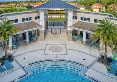 an overhead view of a swimming pool in front of a building at Upstay 9BR Disney Retreat w Pool, BBQ & Hot Tub in Kissimmee