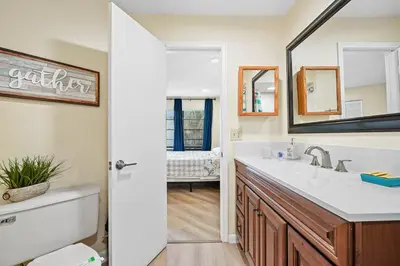 a bathroom with a sink and a mirror at 3648 Orlando Vacational Apartment in Orlando