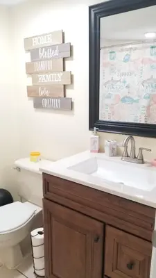 a bathroom with a sink and a mirror at 3648 Orlando Vacational Apartment in Orlando