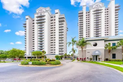 a street in front of two large white buildings at Luxury Condo with Huge Private Balcony on Lake Bryan in Orlando