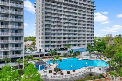 an aerial view of a large apartment building with a pool at Luxury Condo with Huge Private Balcony on Lake Bryan in Orlando