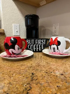 two coffee mugs with cows on them on a counter at Gone 2 Florida Vacation Homes in Orlando