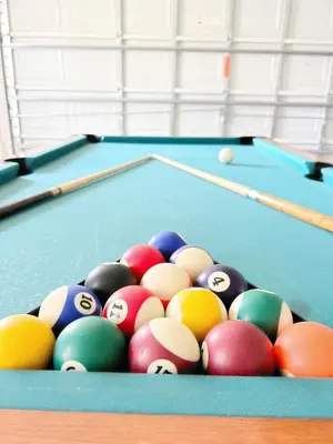 a group of billiard balls on a pool table at Gone 2 Florida Vacation Homes in Orlando