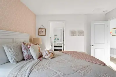 a bedroom with a bed with a stuffed animal on it at Luxury Decor 6BR at Storey Lake sleeps 16 SL2945 in Kissimmee