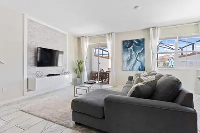 a living room with a couch and a tv at Disney Familly Lovers up to 11 SL4928 in Kissimmee