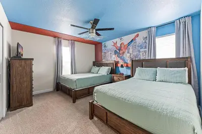 a bedroom with two beds and a ceiling fan at 5BR Themed Bedrooms at Storey Lake SL4702 in Kissimmee